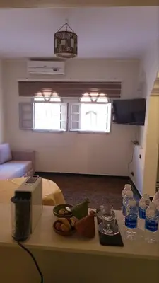 a room with a table with food and water bottles at Desert Getaway Apartment In Ouarzazate in Ouarzazate