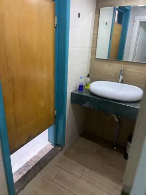 a bathroom with a sink and a mirror at Dar rahma in Khenifra