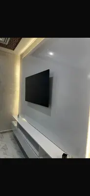 a flat screen tv on a white wall at Shahd in Meknès