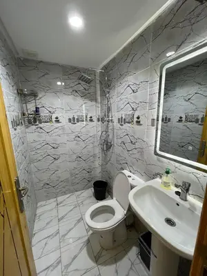 a bathroom with a toilet and a sink at Shahd in Meknès