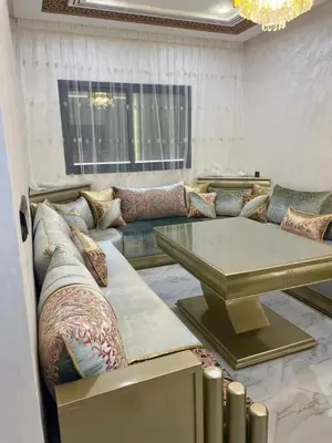 a living room with a couch and a table at Shahd in Meknès