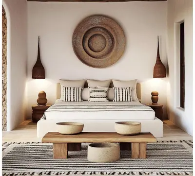 a bedroom with a large bed and a wooden table at Riad Sibaya fes in Fès