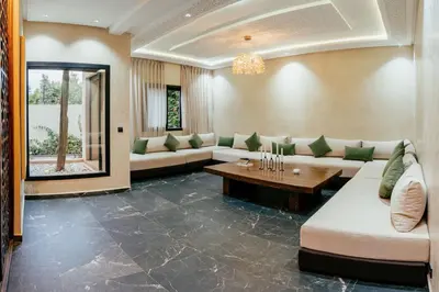 a large living room with couches and a table at Romilli atlas in Sbiti