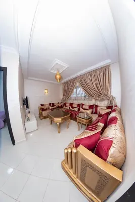 a living room with a couch and a table at Royal Deluxe Fez in Fès