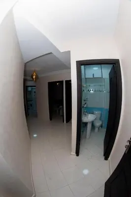 a large bathroom with a sink and a toilet at Royal Deluxe Fez in Fès
