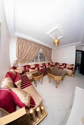 a living room with couches and a table at Royal Deluxe Fez in Fès