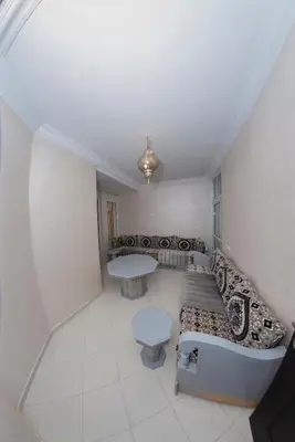 a living room with a couch and a table at Royal Deluxe Fez in Fès