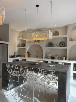 a kitchen with a large table and chairs at Villa Loaïa in Marrakech