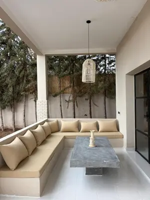 a living room with a couch and a table at Villa Loaïa in Marrakech