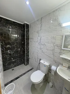a bathroom with a toilet and a sink at Home sweet home in Fès