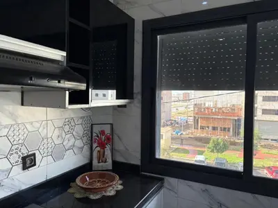 a kitchen with a window with a view of a street at Home sweet home in Fès