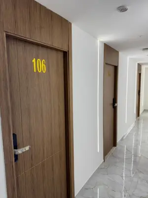 a door with the number on it in a hallway at Hôtel kairouan in Fès