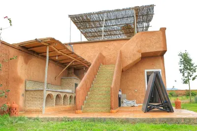a building with a staircase and a stair case at Le Clos des Oliviers Marrakech Villa & Piscine in Marrakech