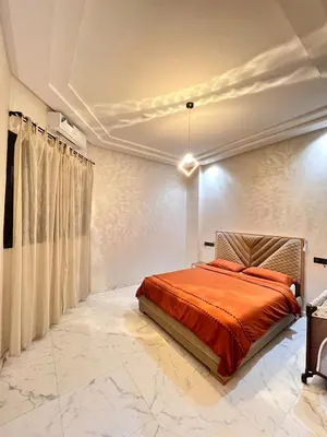 a bedroom with a bed in a white room at White Cactus in Meknès