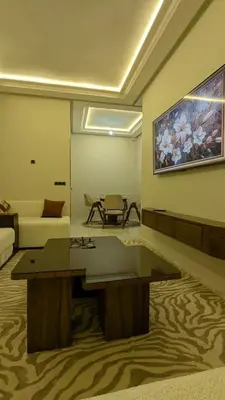 a living room with a couch and a table at NAYA apartment in Fès