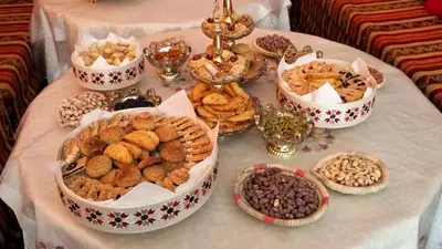 a table topped with bowls of different types of food at Kasbat Taslit in Ouarzazate
