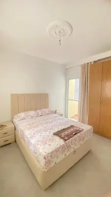 a bedroom with a bed and a window in it at manar immobilier Appart Msnana Golf in Oulad Akkou
