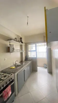 a kitchen with a sink and a stove top oven at manar immobilier Appart Msnana Golf in Oulad Akkou