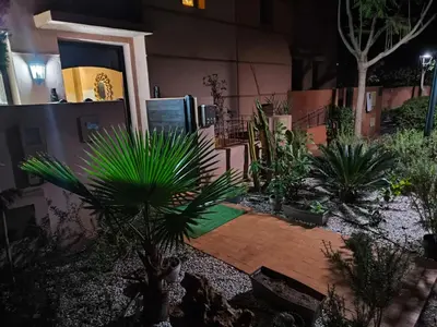 a courtyard with plants in front of a building at villa Les Jardins D'atlas in Oulad Akkou
