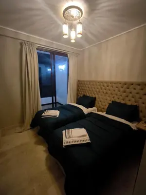 a bedroom with two beds with plates on top of them at villa Les Jardins D'atlas in Oulad Akkou