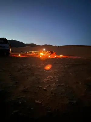 a truck parked in the desert at night at Merzouga Outdoors Private Nomad Expedition in Merzouga