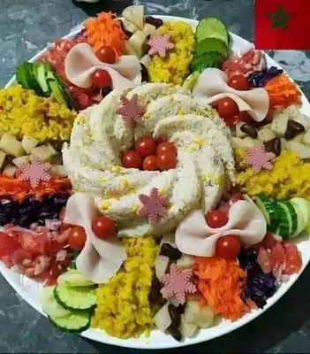 a plate of food with different types of vegetables at Hotel Soleil Blue in Boumalne