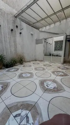 an empty room with a large tile floor in a building at My Amir in Fès