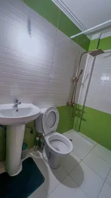 a bathroom with a toilet and a sink at My Amir in Fès