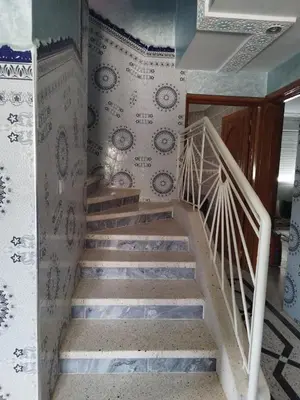 a staircase in a house with wallpaper at Luxurious mountain villa in El Ksiba