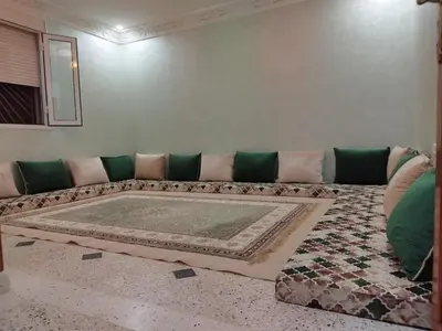 a living room with a couch and a rug at Luxurious mountain villa in El Ksiba