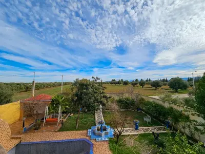 an overhead view of a garden with a playground at Villa rue imouzzer in Fès