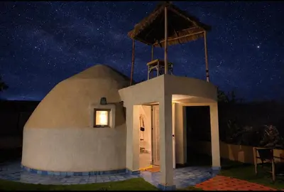 a small building with a night sky with stars at Les Domes de l Ourika in Sidi Bouzguia