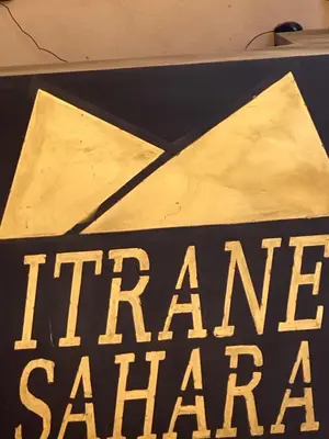 a sign that says fire hazardstaacist on a table at Itrane sahara Auberge in Taouz