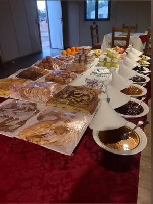 a long table filled with different types of food at Star Desert Camp Merzouga in Merzouga