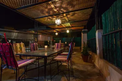 a table and chairs in a restaurant with a table and chairs at Casa Aya Medina in Fès