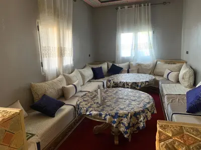 a living room with a couch and two tables at Villa Gomez in Sbiti