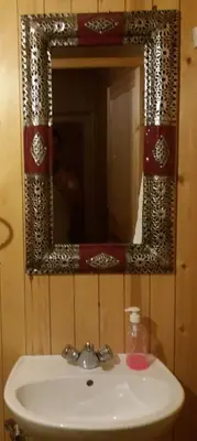 a bathroom sink with a mirror on the wall at La Chambre d hote in Ouarzazate