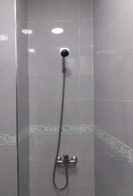 a shower with a shower head in a bathroom at La Chambre d hote in Ouarzazate