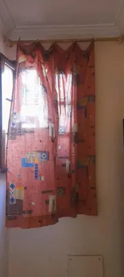a climbing wall in a room with a window at La Chambre d hote in Ouarzazate