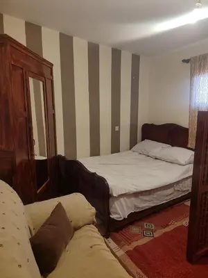 a living room with two beds and a couch at Central Bonheur Studio in Midelt
