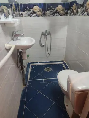 a bathroom with a toilet and a sink at Central Bonheur Studio in Midelt