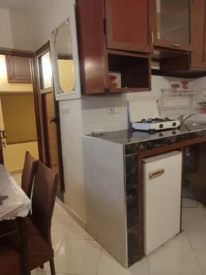a kitchen with a stove and a counter top at Central Bonheur Studio in Midelt