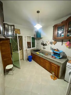 a kitchen with a sink and a counter at appartement luxe in Meknès