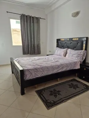 a bedroom with a bed in a room with a window at Appartement atlas fes 5 in Fès