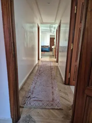 a hallway of a room with a rug on the floor at Appartement atlas fes 5 in Fès