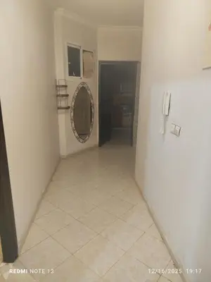 a hallway with a tile floor in a room at Otmania house Meknès in Meknès