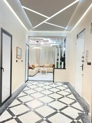a hallway with a living room with a couch at Haut standing apartment in hearth of fez in Fès