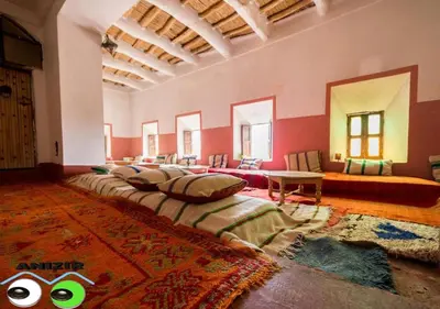a large room with a large bed in it at Kasbah Anizir Itran in Kalaat MGouna