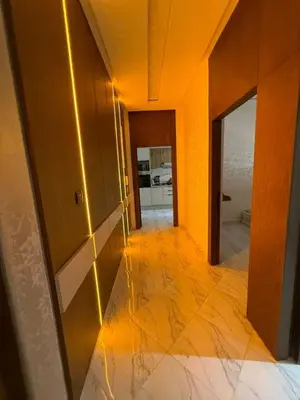 a hallway of a house with orange walls and a mirror at Modern and friendly apartment in Azrou