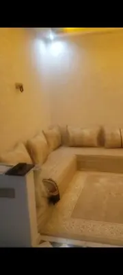 a living room with a couch in a room at mina residence